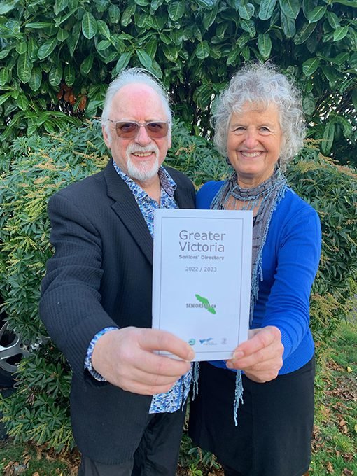 Winnie Cooper and J.P. holding a Victoria Seniors' Directory 2022 Guide